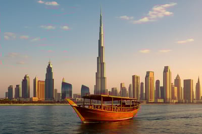 Dubai skyline featuring the Burj Khalifa and traditional dhow boat